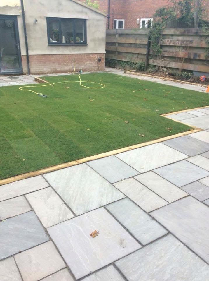 Freshly laid lawn with paved patio area