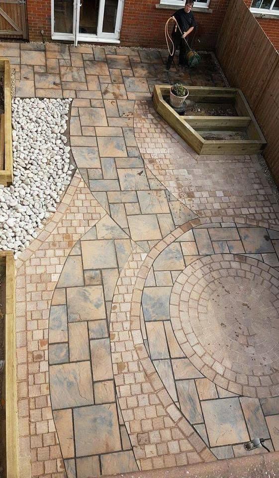 Decorative circle feature paving with raised planters